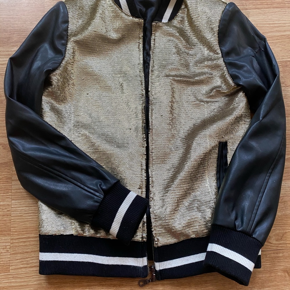 Woman black and gold leather jacket